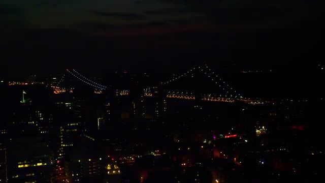 LONG WIDE AERIAL lit George Washington Bridge at night