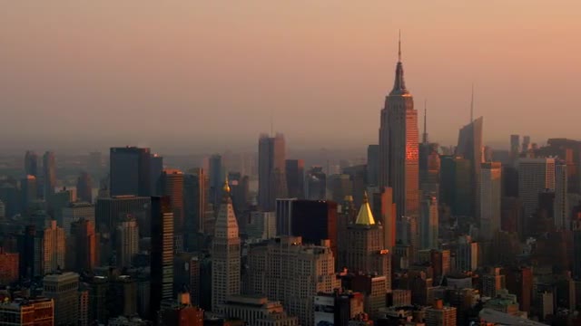 WIDE AERIAL of buildings in downtown and Midtown Manhattan in morning