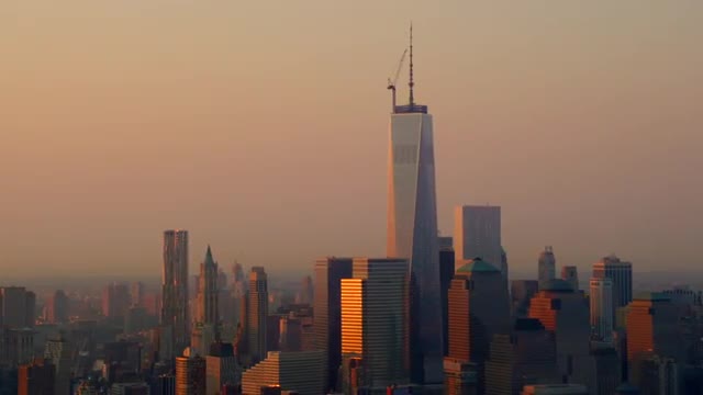 MEDIUM AERIAL of buildings in Lower Manhattan in morning