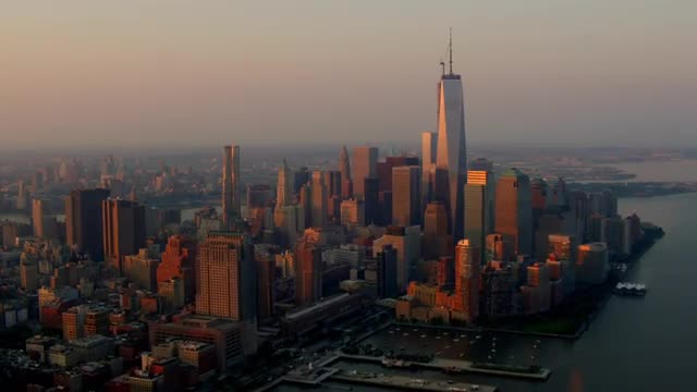 LONG AERIAL of Lower Manhattan skyline and waterfront in morning