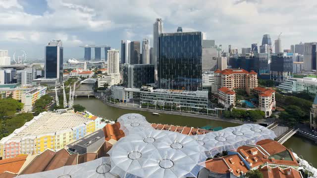  Elevated view over the Entertainment district of Clarke Quay, the Singapore river and City Skyline,