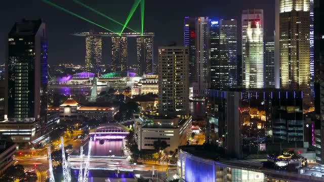  Elevated illuminated view over the Entertainment district of Clarke Quay, the Singapore river and C