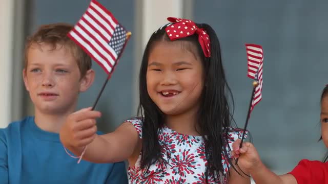 Children waving American flags, shot on Phantom Flex 4K