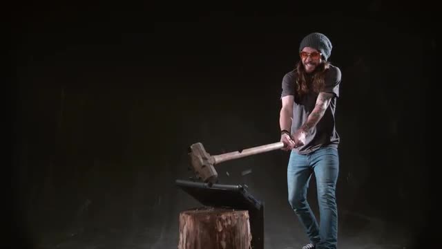 Man smashing laptop with hammer in slow motion, shot on Phantom Flex 4K at 1000 fps
