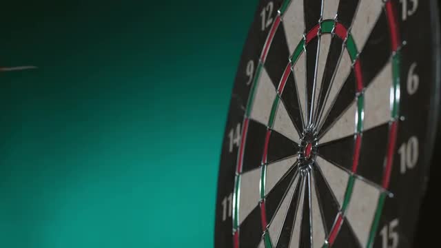 2 shots of darts hitting board in slow motion; shot on Phantom Flex 4K at 1000 fps