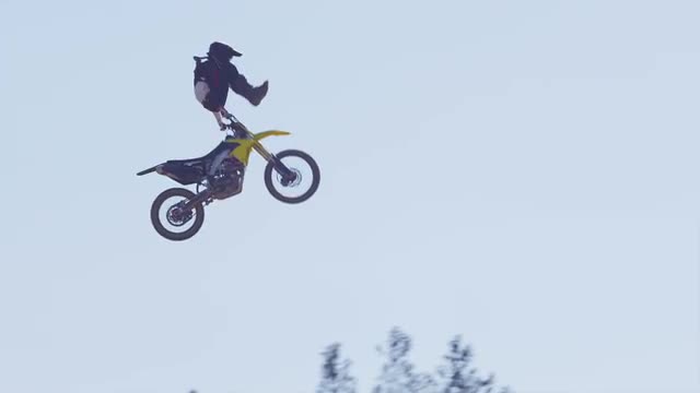 Motocross rider going off big jump, slow motion, 4K shot on RED Epic