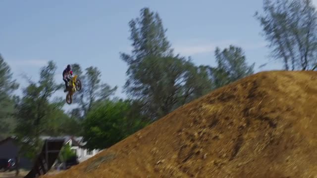Motocross rider going off big jump, slow motion, 4K shot on RED Epic