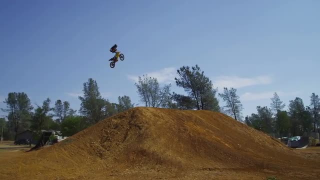Motocross rider going off big jump, slow motion, 4K shot on RED Epic