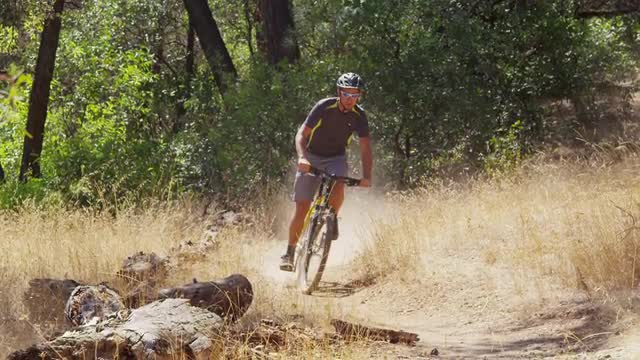 Man riding mountain bike in nature