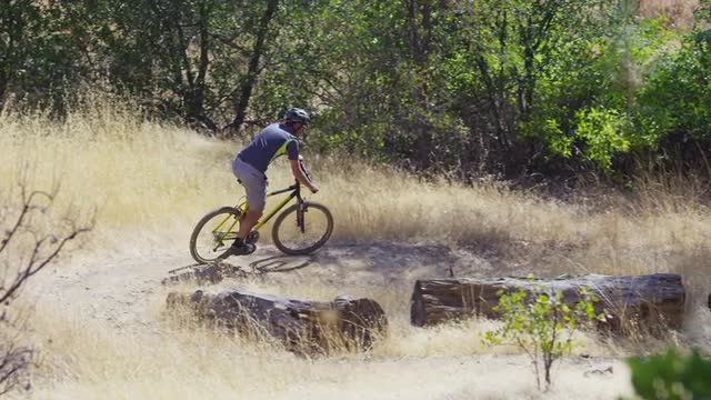 Man riding mountain bike in nature