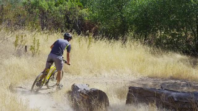 Man riding mountain bike in nature