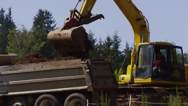 Excavator digging on job site