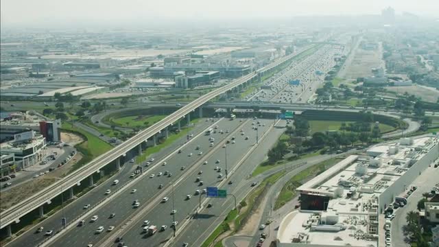 Aerial Dubai City Sheikh Zayed Road moving traffic multi lane UAE