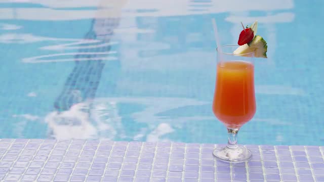 Cocktail by pool. Shot on RED EPIC for high quality 4K, UHD, Ultra HD resolution.