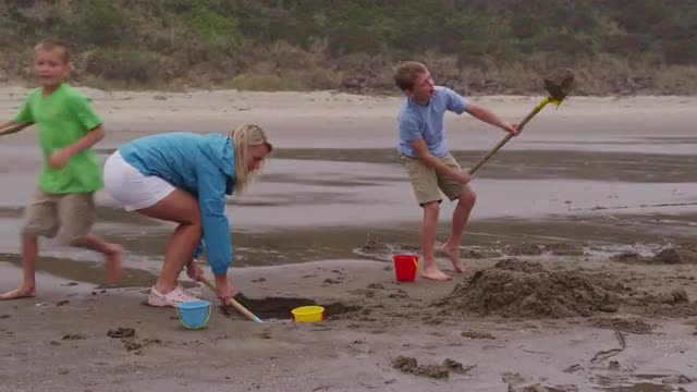 Children playing at beach. Shot on RED EPIC for high quality 4K, UHD, Ultra HD resolution.