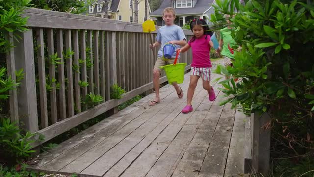 Kids walking across bridge. Shot on RED EPIC for high quality 4K, UHD, Ultra HD resolution.