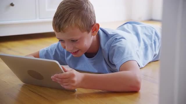 Young boy using digital tablet. Shot on RED EPIC for high quality 4K, UHD, Ultra HD resolution.