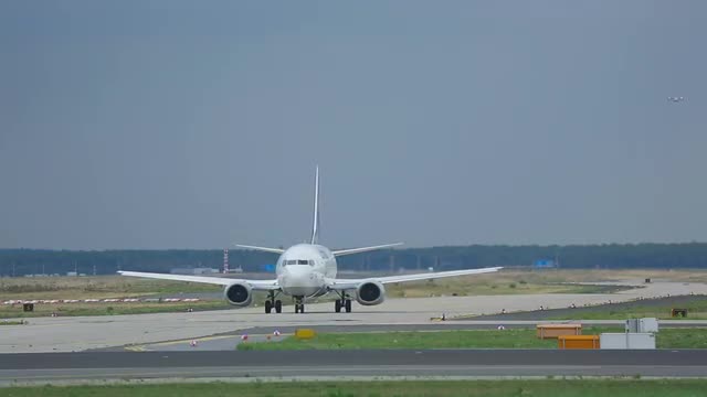 Airplane taxiing on apron