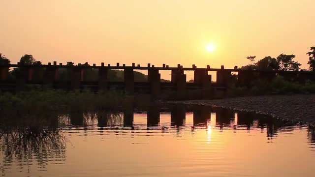 Bike crossing the bridge during Sun Set