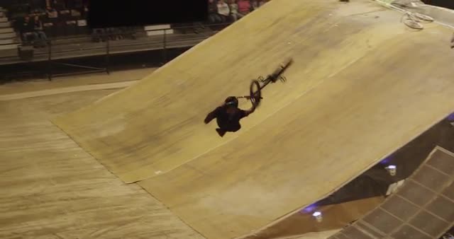 BMX rider performs backflip double tailwhip