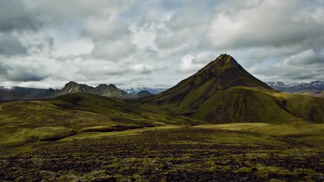 Timelapse of clouds passing by over some mountains near Alftavatn lake, in Iceland