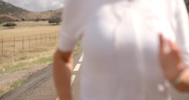 Fit Girl Running on Mountain Road