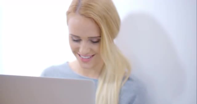 Blurred Woman Using her Laptop Computer