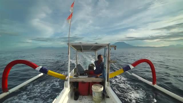 Man Captains Pontoon Fishing Boat