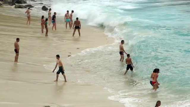 Vacationers Play at the Beach