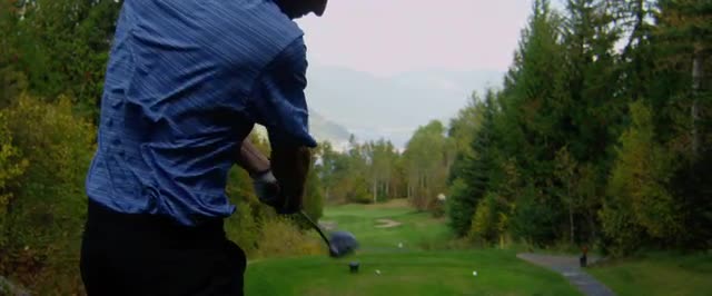 Close up shot of golfer hitting golf ball