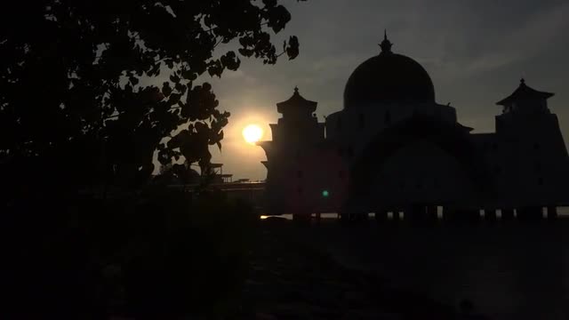 4k footage of sunrise at Floating Malacca Straits Mosque