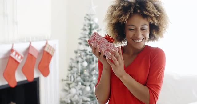 Excited young woman with an unexpected gift