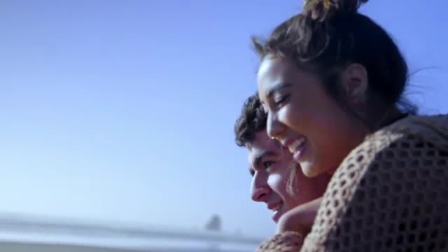 Guy gives girl piggyback ride