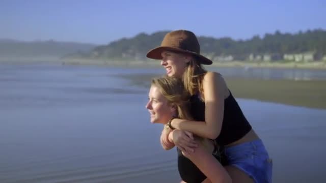 Boy and girl give piggyback rides