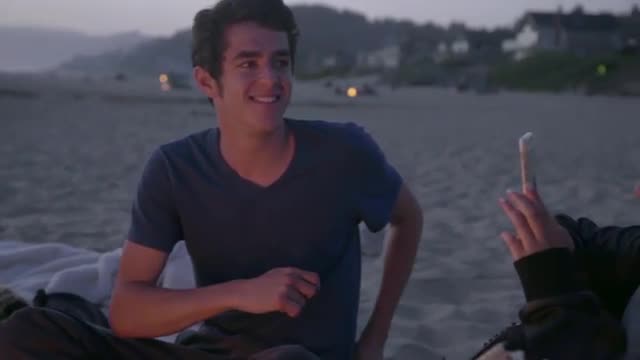 Attractive teen takes picture of friends 