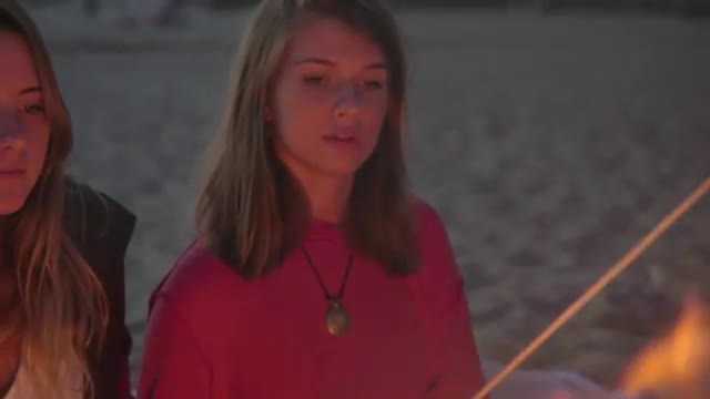 Attractive girls roast marshmallows 