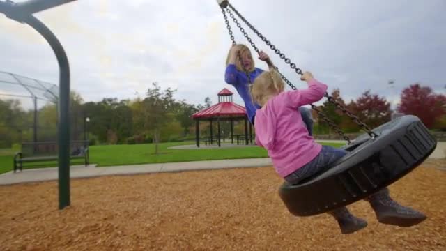 Big sisters gives little sister a ride 