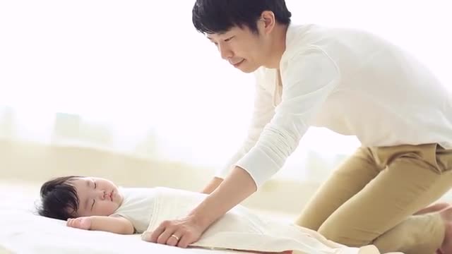 Baby and father taking a nap