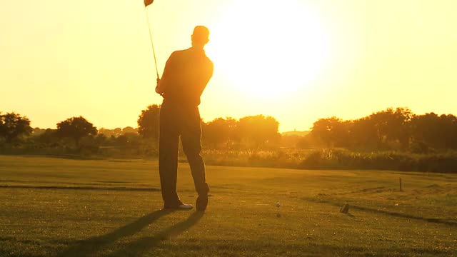 Male Caucasian Golfer Practicing Swing Silhouette
