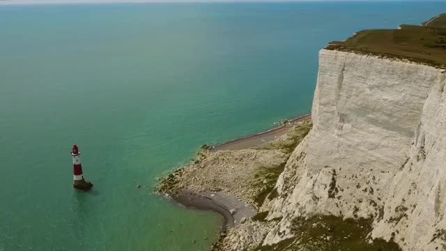 High aerial drone footage of Seven Sisters lighthouse and Beachy Head 
