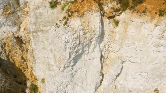 Close-up aerial drone footage of Seven Sisters chalk cliffs 