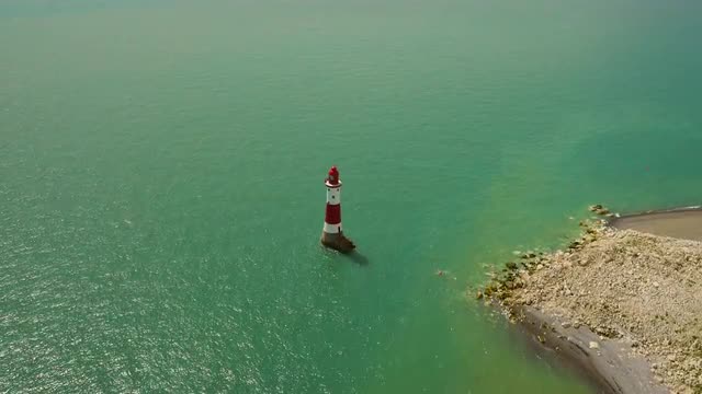 High aerial drone footage of Seven Sisters lighthouse 