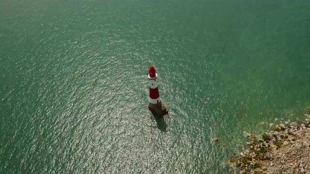 High aerial drone footage of the Seven Sisters lighthouse 