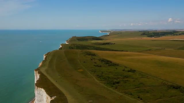 High aerial drone footage of Seven Sisters and the sea 