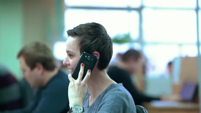 Call Centre Agents Working in Their Bright Office