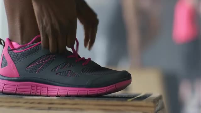 Athlete tying shoelace