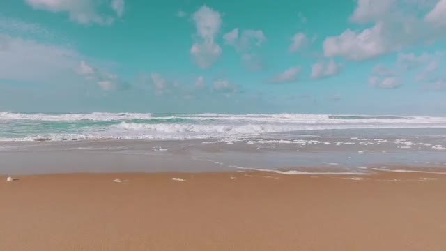 Ocean Waves Incoming on Sand Beach, POV walking