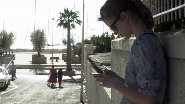01_21_15_Girl_is_Using_Phone_Outdoors