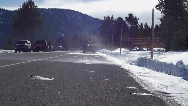Snow blowing across a road
