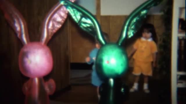 1974: Kids meet creepy blow up Easter bunny dolls. 